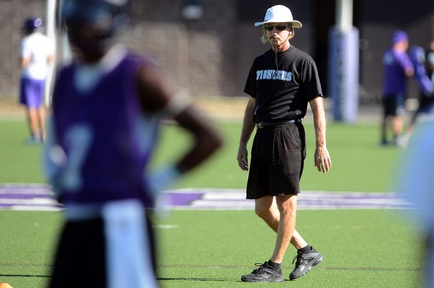 Pioneer head football coach Paul Test walks through morning practice at Pioneer High School on Monday. Melanie Maxwell I AnnArbor.com